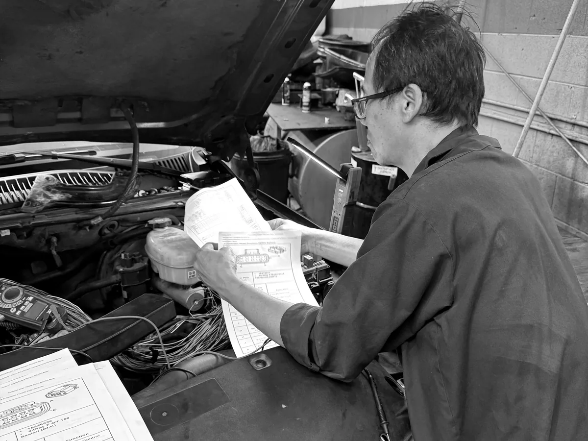 ATS Auto Repair Hammond technician running electrical diagnostics under the hood