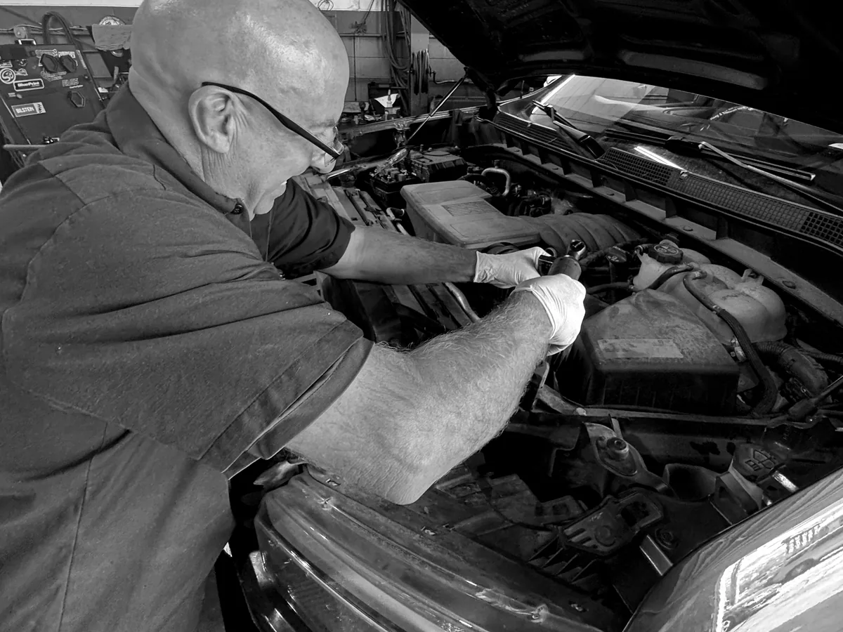 ATS Auto Repair Hammond technician performing hands-on under-hood repair